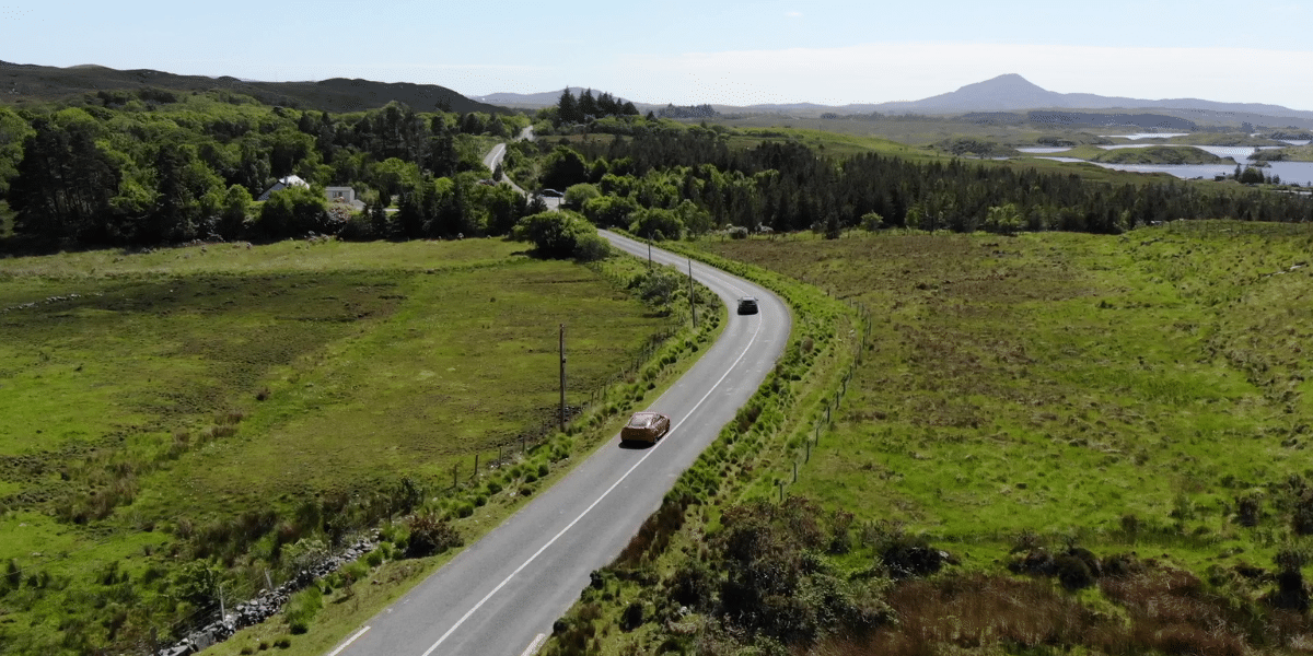 Red car on irish remote road on rico rally